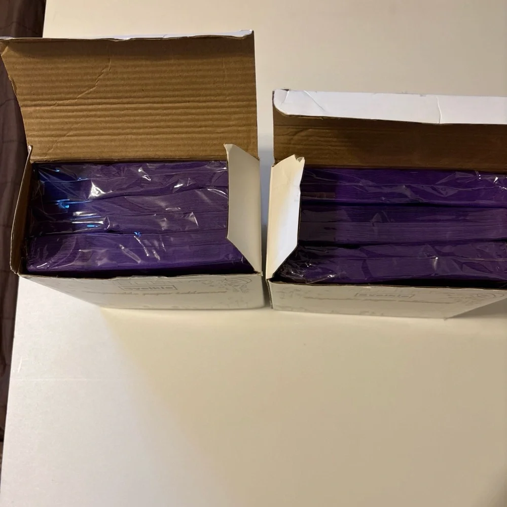 Purple disposable napkins. 150 in each box.